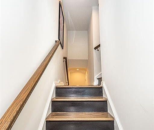 Entryway stairs. Continue straight to get to your 2-door garage. Or take a right up the stairs to the 2nd level family room/kitchen.