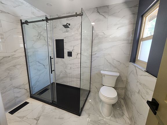 Master bathroom with shower, window and vanity