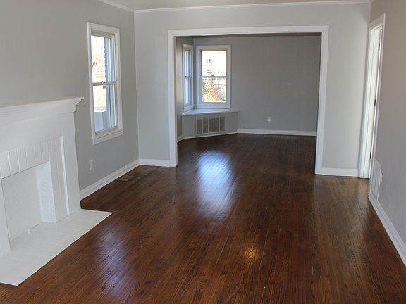 As you walk into the house, you are in the living room that extends into the dining area and kitchen