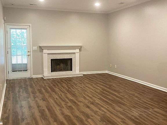 LARGE living room with brand new recessed lights and floors