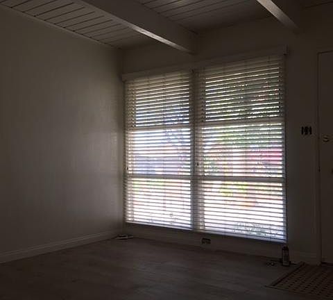 Living room showing the open bean ceiling