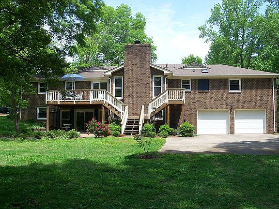2 car garage, outdoor deck, mature park-like yard