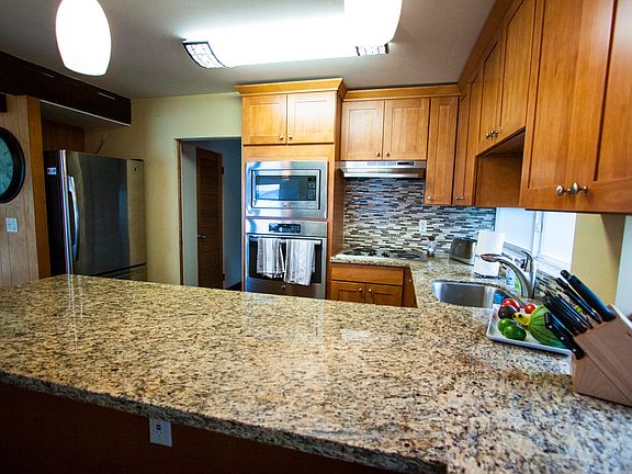 Stainless refrigerator, wall stove, microwave, cook top and