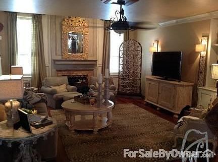 Family room
						:
						with fireplace and wood floors