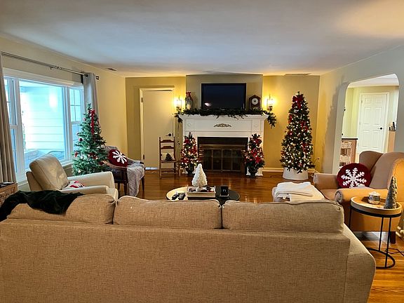 Another view of living room with fireplace