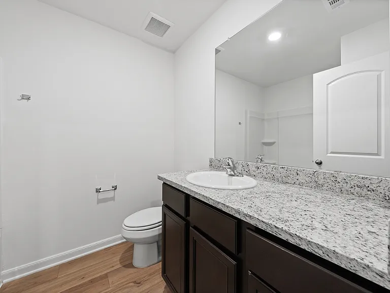 Additional bathroom located upstairs.