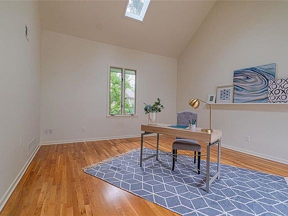 STEP DOWN INTO STUDY/PLAY ROOM/LIVING ROOM OFF OF ENTRY. LOTS OF NATURAL LIGHT.