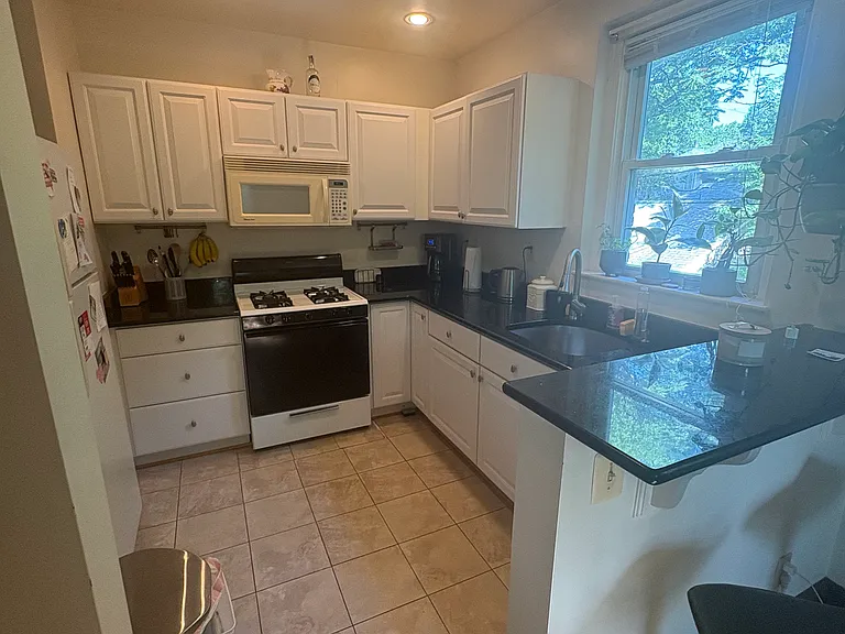 Kitchen with Breakfast Bar Open to Dining Room