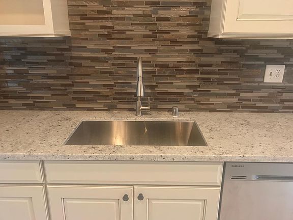 Sink with brand new glass tile backsplash