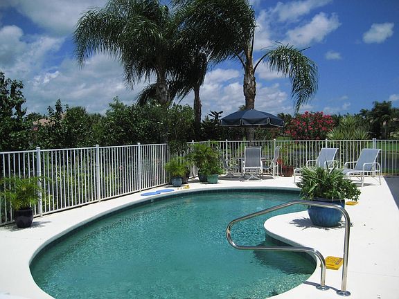 Pool is surrounded by colorful Hibiscus & Oleander