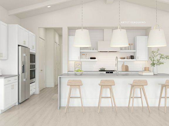 Kitchen with spacious island and pendant lights