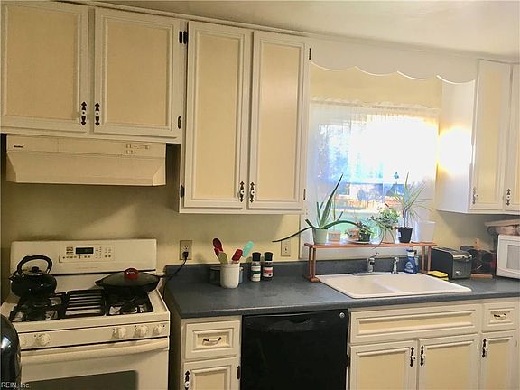 Lots of cabinet space and a very LARGE pantry (not pictured).