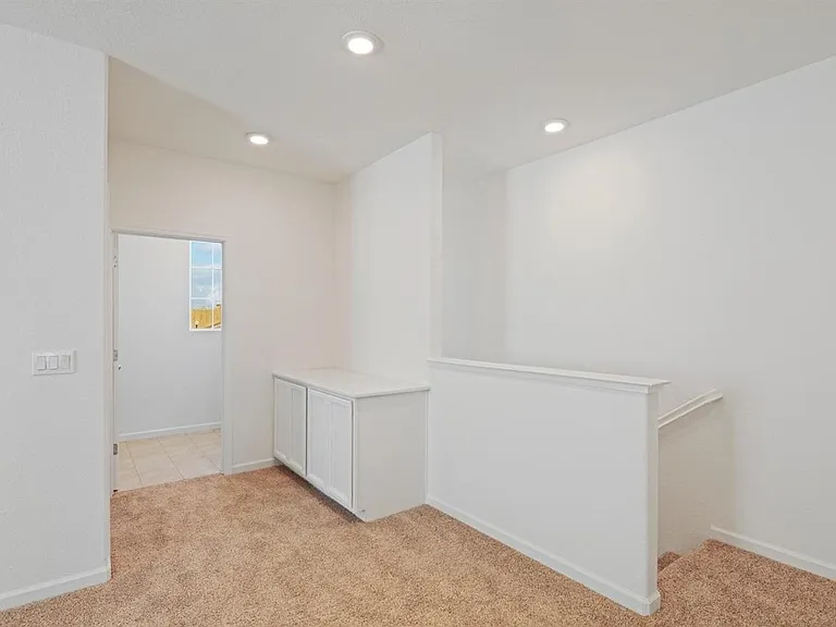 Loft (as you take the stairs)... Washer, Dryer room (Washer, Dryer included in the unit)