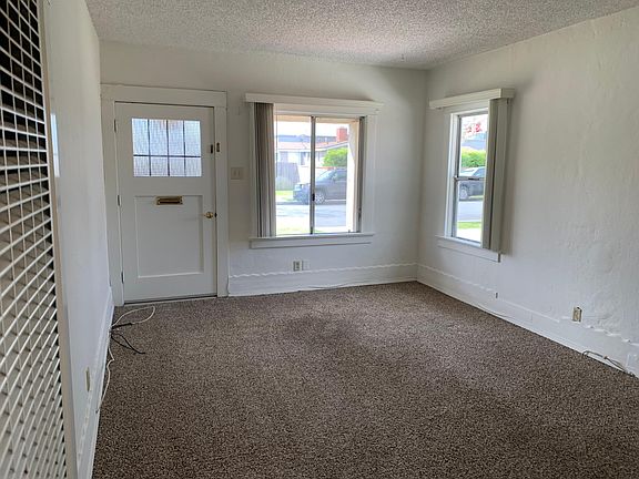 Front Living Area and Wall Furnace with Thermostat