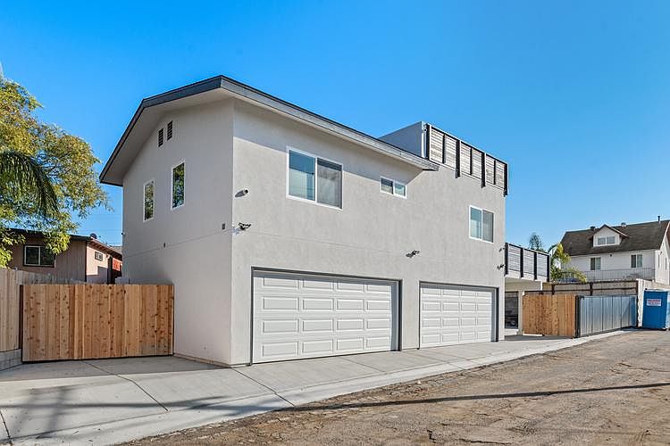 Alley access. Left Fence access, parking spot in front of fence. 2 car Garage on Left for tenant. Right Garage for owner.