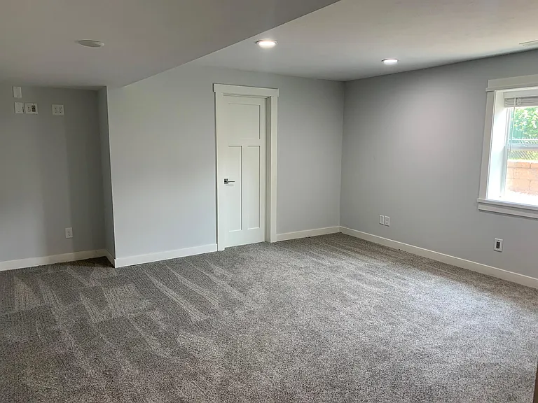 Lower level living area. Two full walls for large screen TV