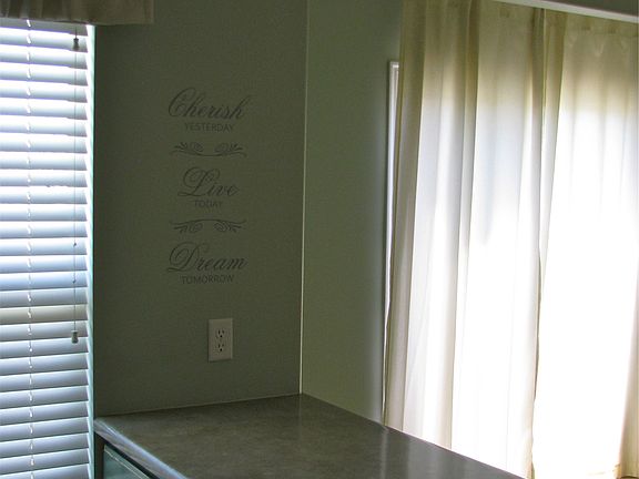 Kitchen bar looking into breakfast nook