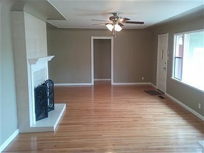 Big open family room with old refinished hardwood floors!