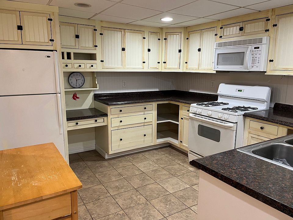 Functional and attractive kitchen with floor lighting.