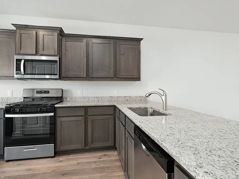 The kitchen has beautiful granite countertops.