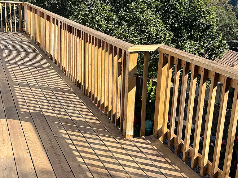 Long deck overlooking bay and mountains