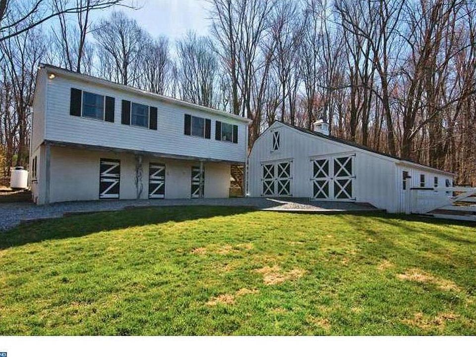 Apartment is the second floor of a separate building on property