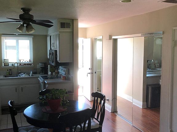 Kitchen table, mirrored laundry doors. Down stairs 1/2 bath