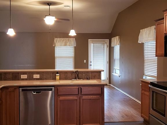 Kitchen, view 2, Pantry, Dishwasher, Disposal, Electric smooth top stove, Microwave, Refrigerator (not warranted), Breakfast bar