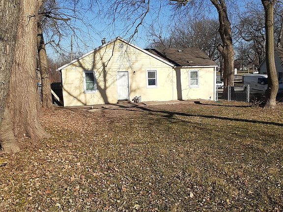Fenced backyard with a patio