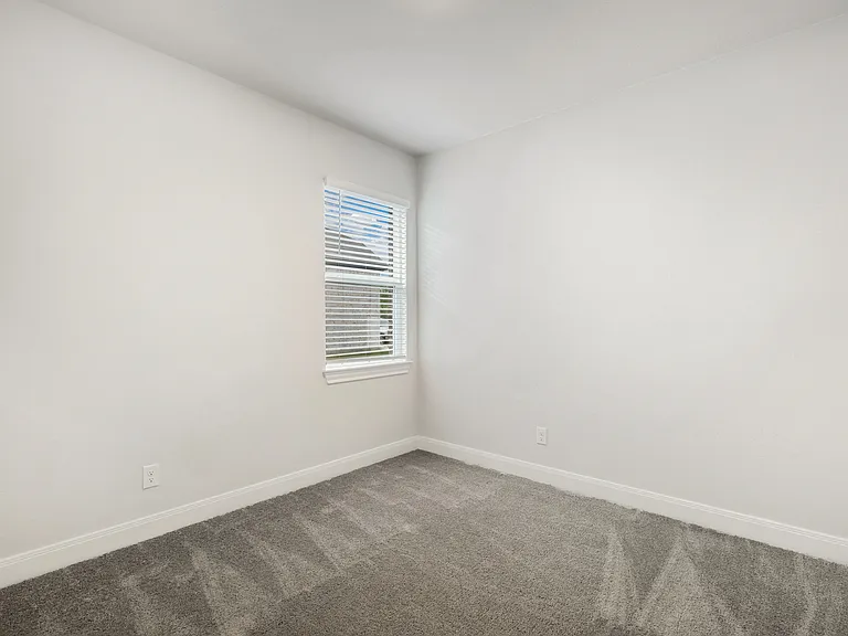 Each secondary bedroom features lush carpet flooring.