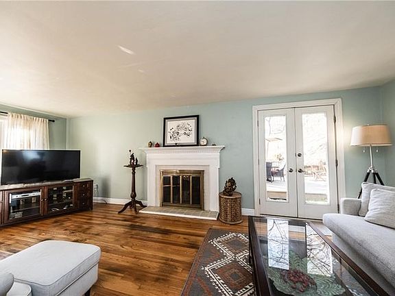 Sun drenched living room. French doors to patio.