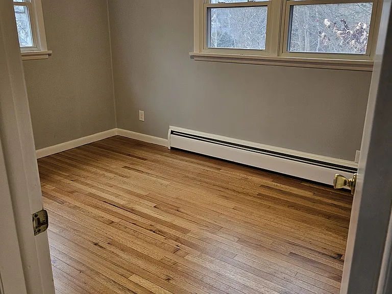 Bedroom #1
Lots of windows, large closet, freshly painted, and beautiful hard wood flooring.