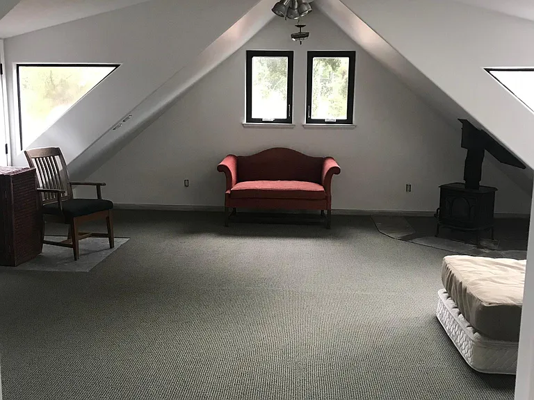 Very large upstairs master bedroom with a lovely wood stove for cozy evenings. Separate entrance very convenient for roommates or visiting guests.