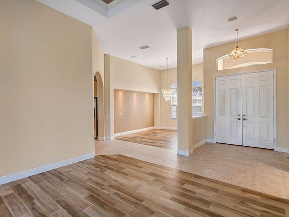 Looking from Living room 14'x12' into Dining room 12'x13' and Double door Foyer.