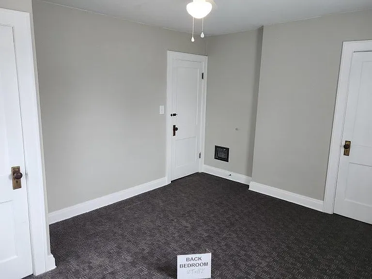 Back Bedroom 12'9" x 11'2", new ceiling fan, 3 windows with cordless blinds, carpet, two closets