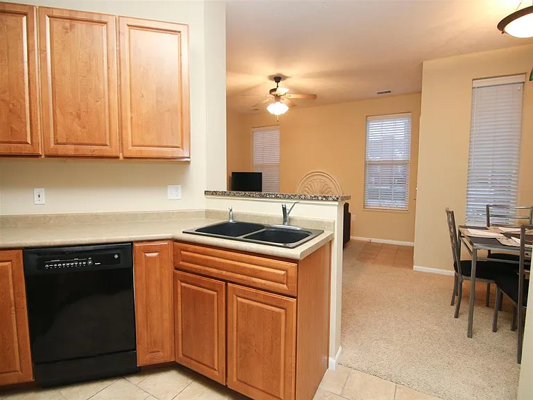 Stay connected while you cookthis open kitchen with ample counter space and cabinetry flows effortlessly into the dining area.