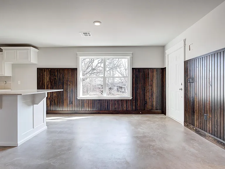view of the front entry and dining area with alot of natural lighting