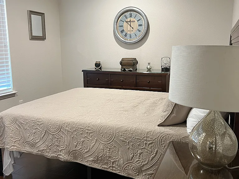 Spacious forth bedroom with flexible sleeping arrangements and elegant furnishings.