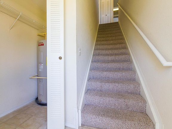 Entry way with generous closet, staircase takes you to your