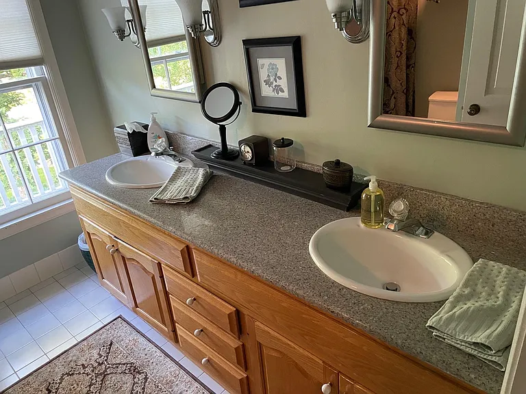 Second bath upstairs has dual sinks. Bathtub and shower.