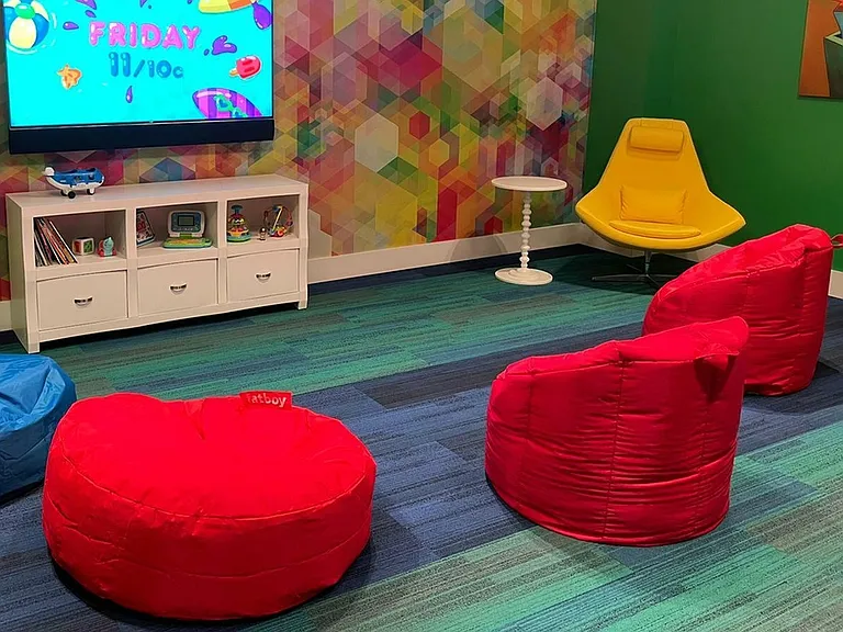 Children can relax on a bean bag chair in the Kid's Playroom!