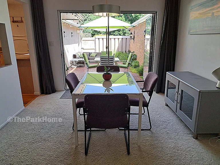 Glass sliding door opens to the private, fenced-in patio.