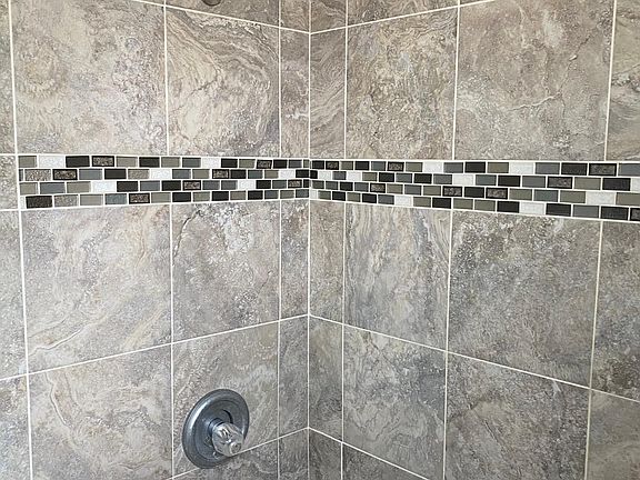 Updated bath with tiled shower