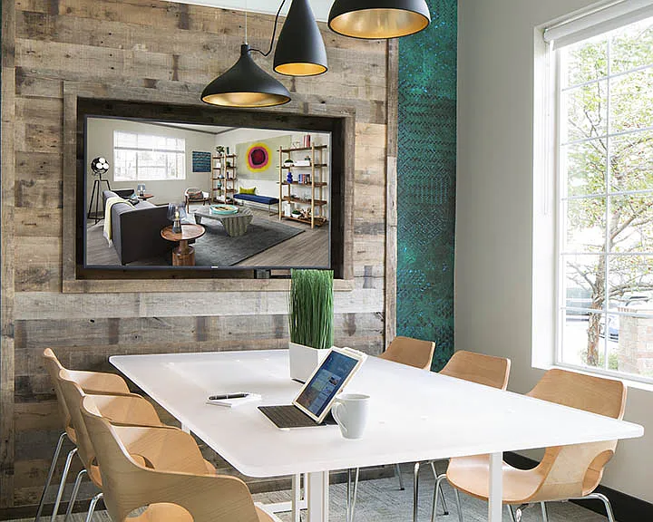 Apartment community business center with conference room at Griffis Belleview Station in Denver, Colorado.