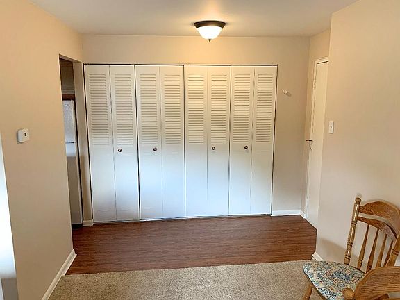 Entry is lined with multiple closets, and newer vinyl flooring!