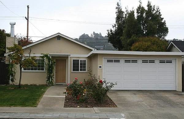 Front of house with rose bushes