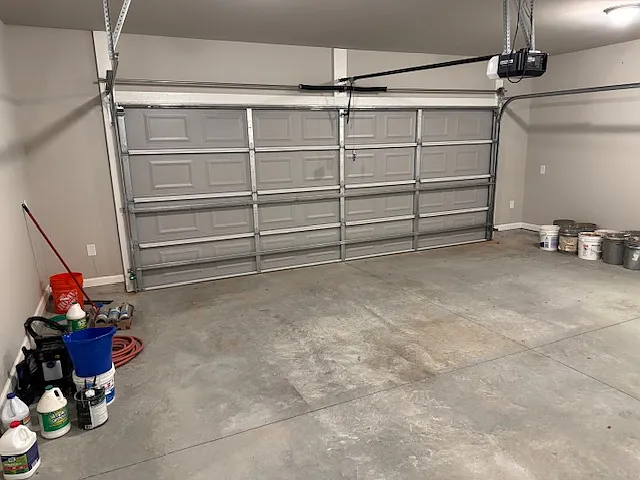 Garage door is 18' by 6' with electric door opener