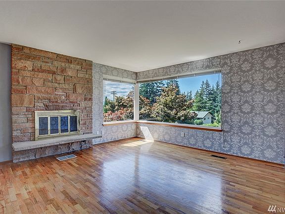 Front Room with wood burning fireplace.
