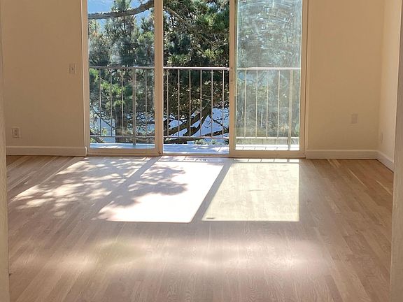 Sunlit living room, new hardwood floors, balcony overlooking Glen Canyon