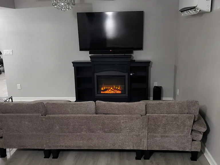 Cozy up with a year-round faux fireplace while relaxing on the couch or lounging in the comforts of your bed.